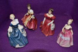 A selection of figurines of ladies in dress including Royal Doulton