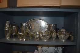 A collection of fine plated wares, amongst which are decorative trays and tea pots, champagne