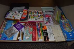 A variety of art supplies among which are watercolour and drawing pencils, unused boxes of Reeves