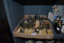 An array of mixed vintage and antique cutlery, various uses and styles.