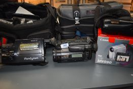 A selection of video cameras including Sony Handycam, Sony Handy Cam Hi8, Epoca 135, Canon MV890
