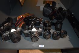 A selection of cameras, lenses and tripod including Praktica LTL3, Praktica LTL, Minolta Dynax 60
