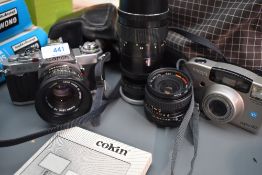 A Canon AV-1 camera with Canon 50mm lens, Pentacon 4/200 lense and super Ozeck 28mm lens also