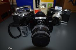 A selection of cameras including Minolta Dynax 5000i, Minolta A, Kodak Instamatic Reflex, a Pentax