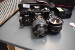 A Vivitar XV2 35mm camera with Vivitar 50mm and 135mm lens