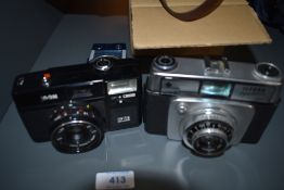 A selection of cameras and equipment including Ilford Sportsman, Prayonx 35mm, light meters, filters