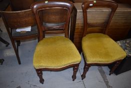 A pair of Victorian mahogany balloon back dining chairs