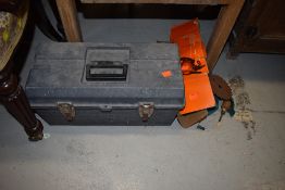 A toolbox and contents including Black and Decker power saw parts