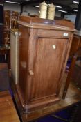 A traditional pot or bedroom cupboard in mahogany
