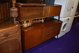 A vintage atomic styled side board unit by Nathan having blue badge ribbed drawer set and over