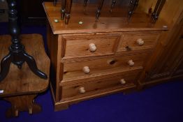 A modern pine chest of two over two drawers