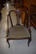 An Edwardian inlaid salon armchair