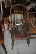 A traditional windsor armchair, in need of restoration