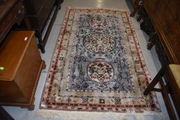 A traditional oriental style fireside rug, deep pile, approx. 183 x 107cm
