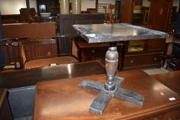 A small oak occasional pedestal table