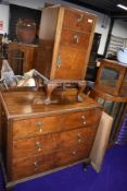 An Edwardian chest of two over two drawers and accompanying side cupboard