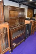A vintage dark oak four tier stacking bookcase, labelled Gunn, width approx. 87cm, height 157cm