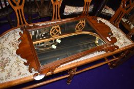 A mahogany framed decorative wall mirror