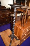 An antique wine table having mahogany frame with barley twist stem