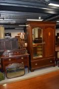 An Edwardian mahogany and inlaid two piece bedroom suite comprising mirror door wardobe and dressing
