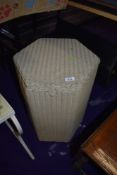 A vintage Lloyd Loom hexagonal laundry basket