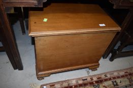 An early to mid 20th Century bleached mahogany bedding box/maybe ex gramophone cabinet, on ball