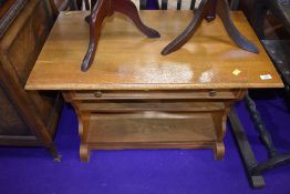 A light oak coffee table with integral drawer 80cm wide by 46cm deep by 55cm tall