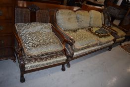 A late 19th/early 20th Century bergere back lounge suite , having mahogany, walnut and bergere