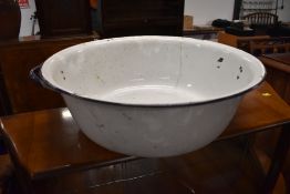 A large enamel wash bowl in blue and white