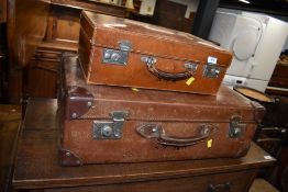 Two vintage leather bound travel trunk or suitcase initialled S.R.W