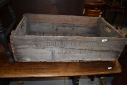 A vintage wooden crate, stamped for United Glass Ltd, Lancaster