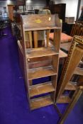 An Edwardian narrow oak book shelf approx 50cm wide