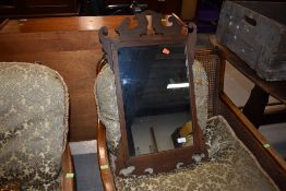 A Chippendale style oak mirror