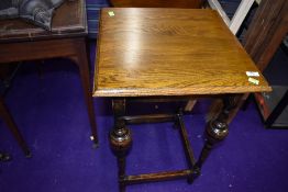 an Edwardian side table having unusual turned legs