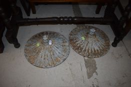 A pair of cast iron covers