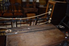 A pair of cast markers, possibly putting green posts