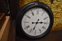 An oversized wall clock in plastic frame (damaged)