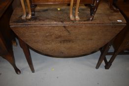 A 19th Century oak drop leaf table on tapered legs, width approx. 93cm