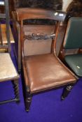 A mahogany framed dining chair with carved back