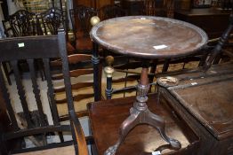 A reproduction mahogany wine table, feet damaged