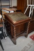 A 19th Century mahogany davenport , in need of restoration but looks sound