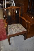 A 19th Century stained frame arm chair having splat back and upholstered seat