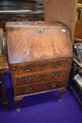 A small size flame mahogany veneer bureau approx 60cm wide by 100cm tall