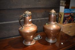 A pair of 19th Century copper lidded ewers
