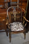 A traditional wheelback carver chair