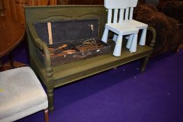 A two seater wooden garden bench