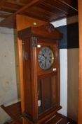 An early 20th Century mahogany cased wall clock, height approx. 77cm