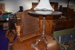 A tilt top side table with mahogany top on turned oak frame