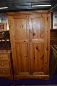 A modern solid pine bedroom wardrobe