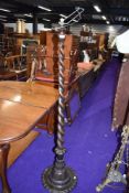 a large standing standard lamp having barley twist stem